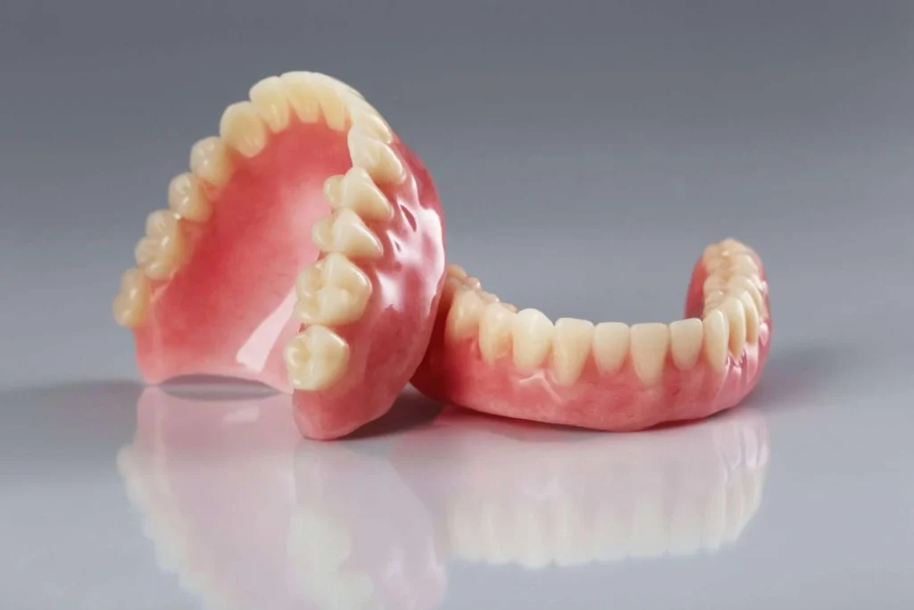 Upper and lower complete dentures ready for fitting