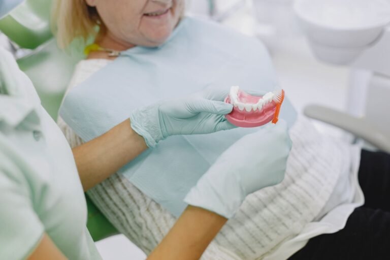 Senior patient in a dental chair discussing immediate dentures after extractions