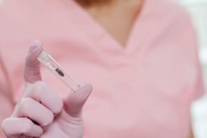 Dental professional holding an implant model in Richmond Hill