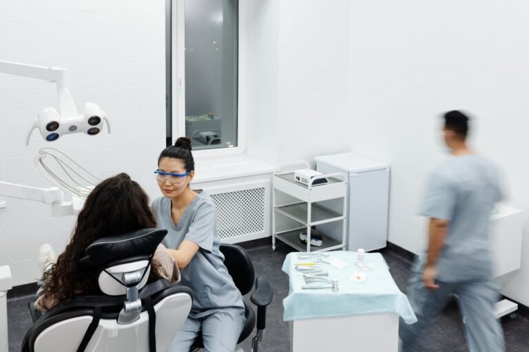 Dentist examining a patient with a painful dental crown in Richmond Hill