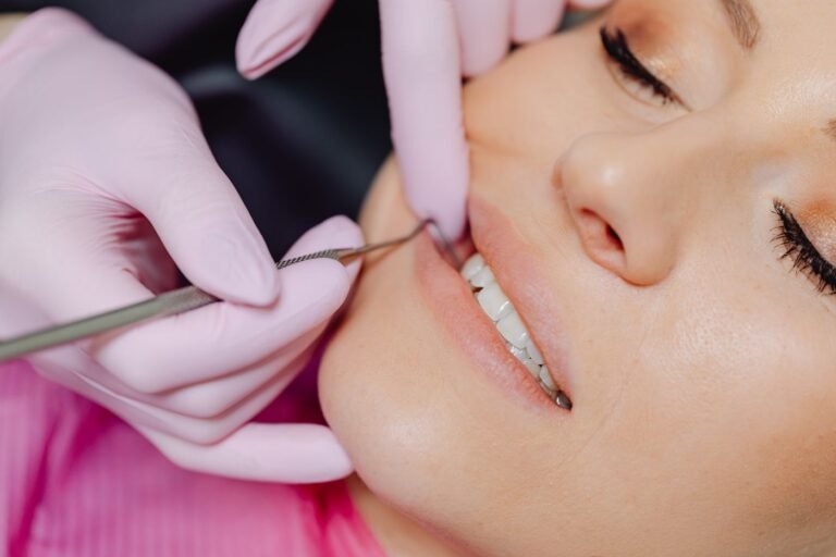 Dentist examining a patient before placing a tooth-coloured filling